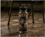 A sticker-covered water bottle on the rehearsal-room floor.