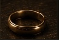A wedding ring on a dressing-room counter.