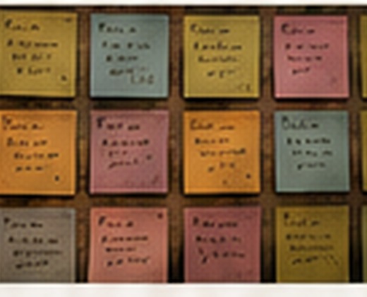 A wall of color-coded Post-it notes.